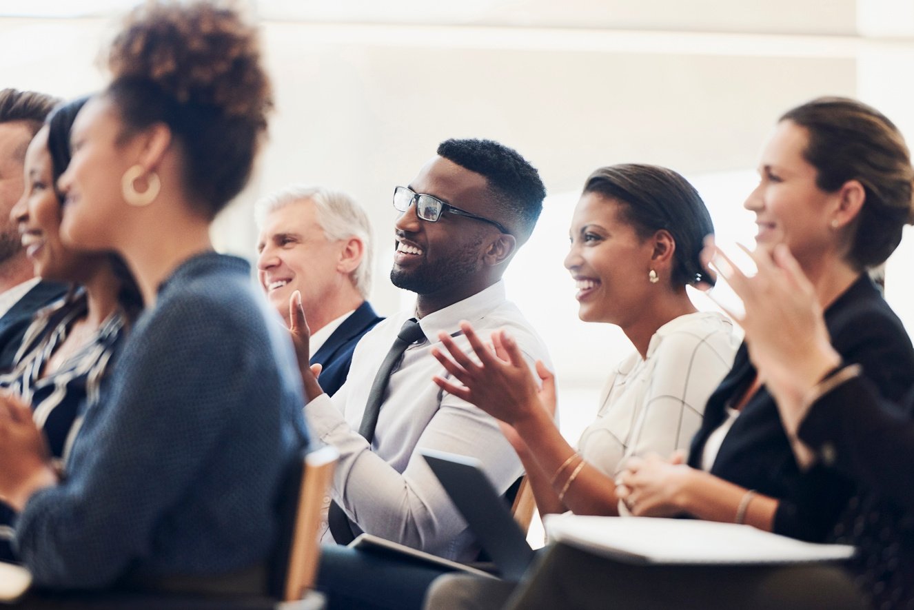 Business People Clapping during a Semina 